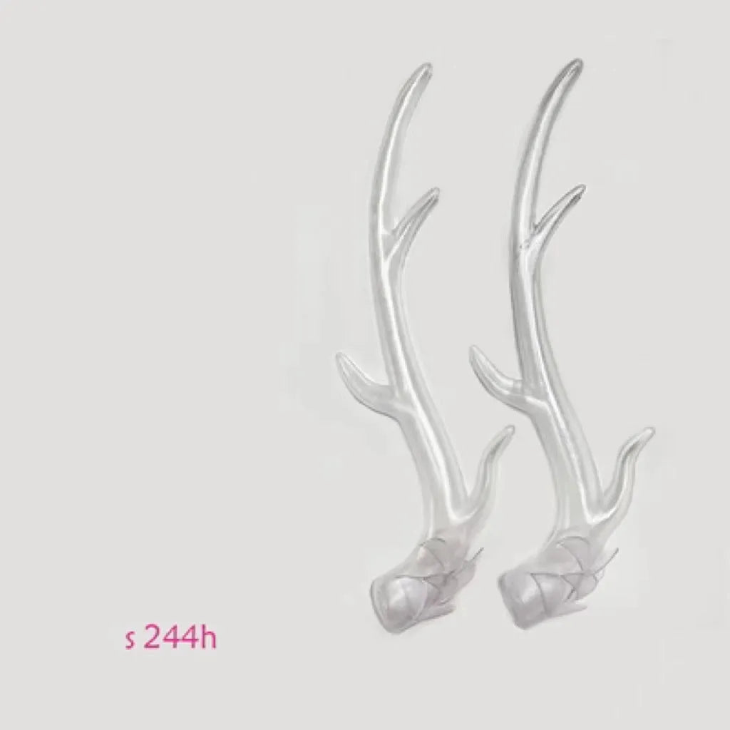 A pair of detailed black resin dragon horn decorations for customising motorcycle and scooter helmets.