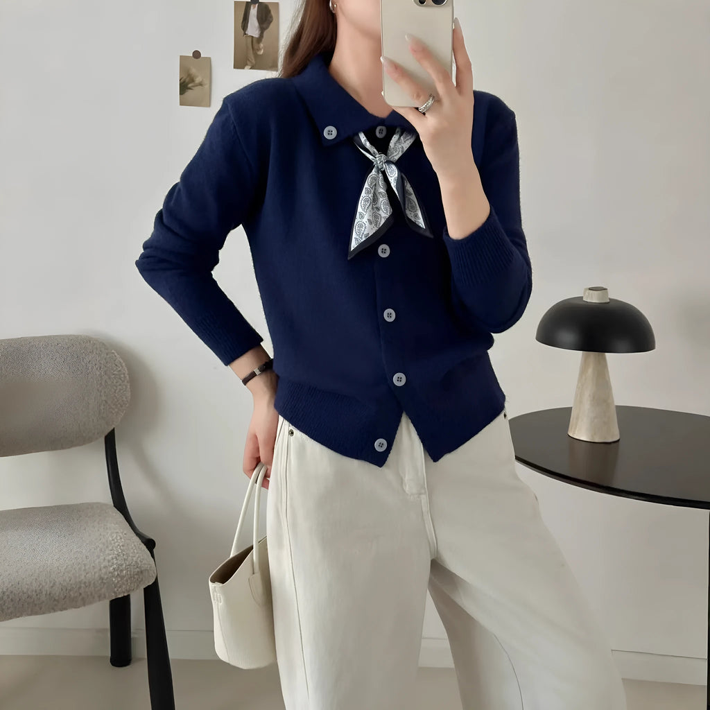 Women's milky white cardigan sweater with a built-in lapel scarf collar and long sleeves.