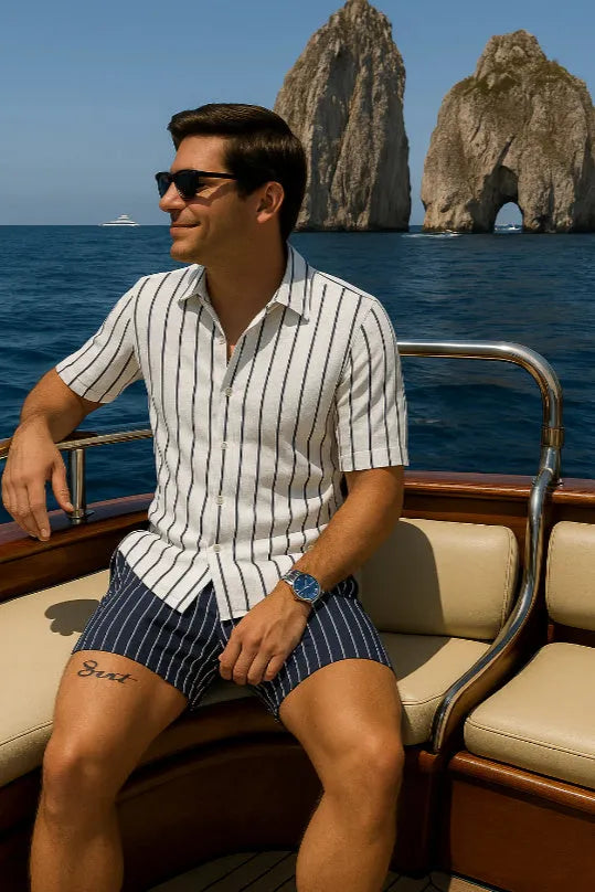 Men's blue beach shirt and shorts set on hanger showing four-sided elastic fabric texture