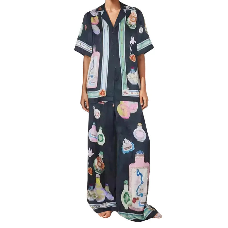 Black women's casual set with cartoon print, featuring a long-sleeve cardigan and trousers.