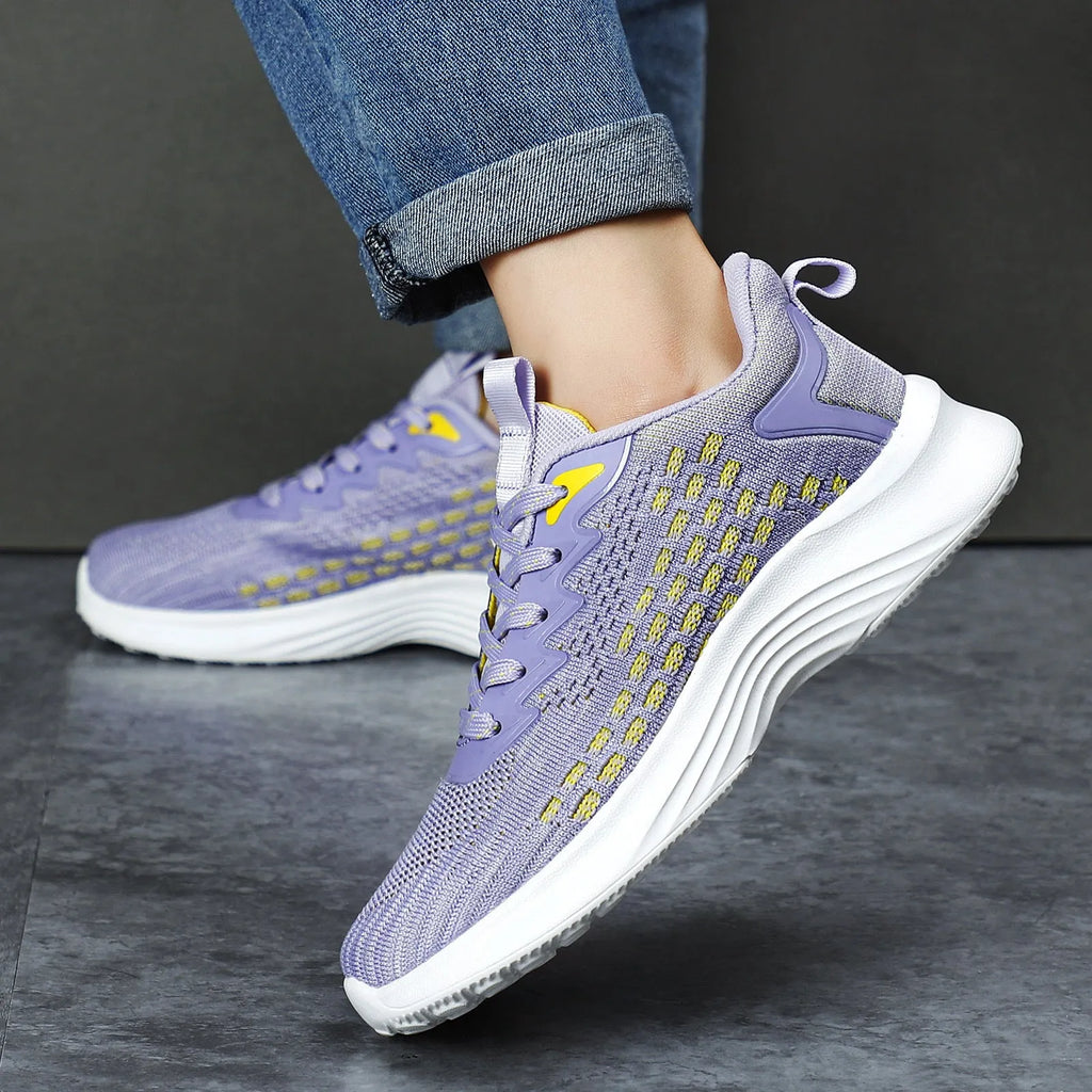 Women's Lavender Purple Flyknit running shoes with striped pattern and mesh lining on white background