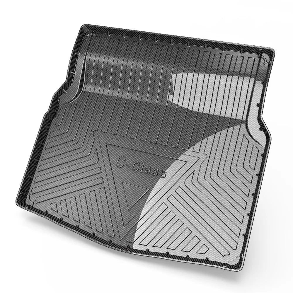 Black carbon fibre pattern TPE rubber boot liner mat for a car trunk.