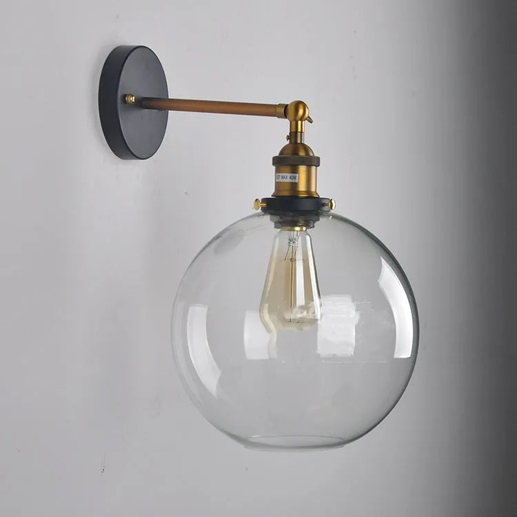 20cm round glass ball wall lamp in amber, smoke grey, or transparent on aluminium holder.