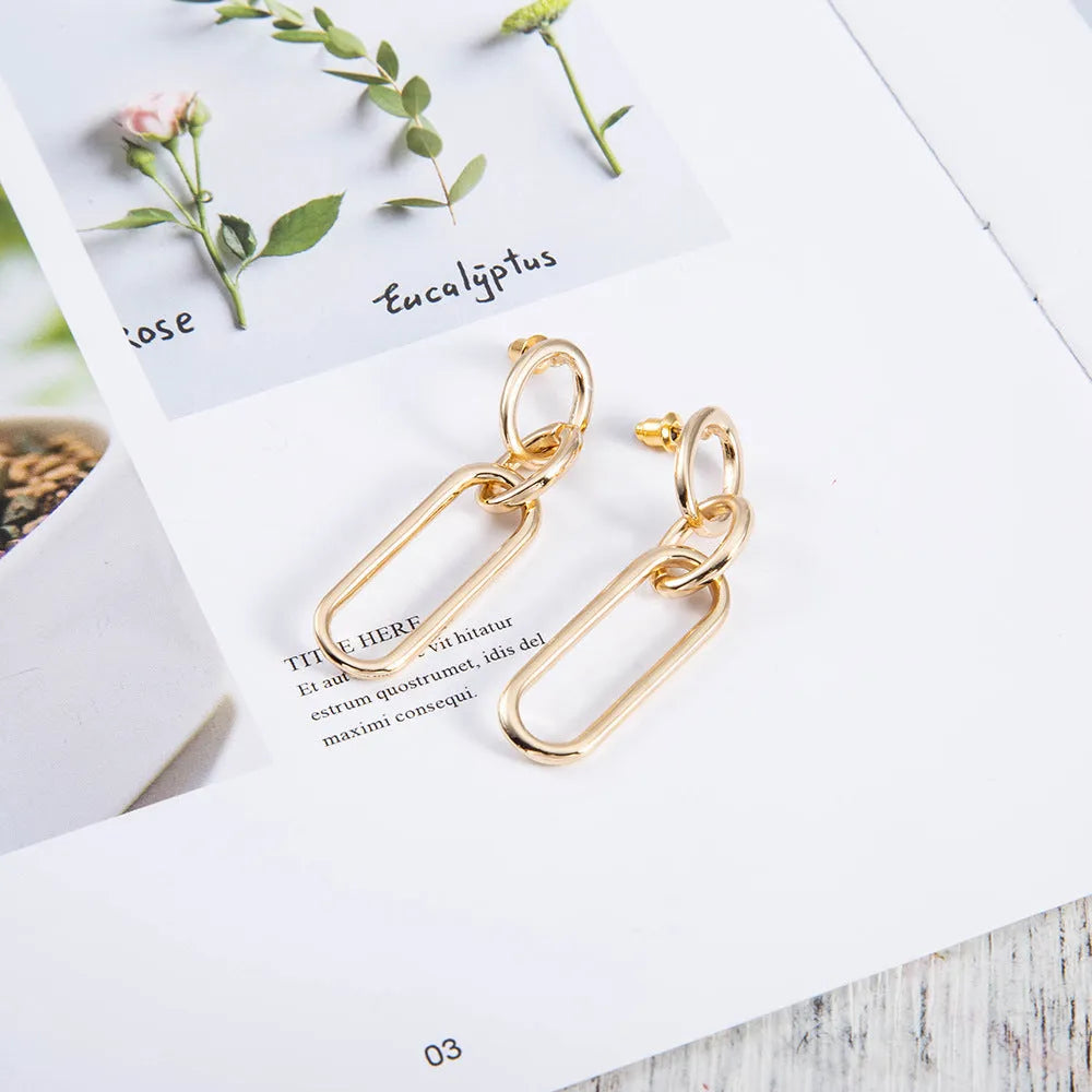 Geometric sterling silver needle colour hoop earrings with ring and line design elements