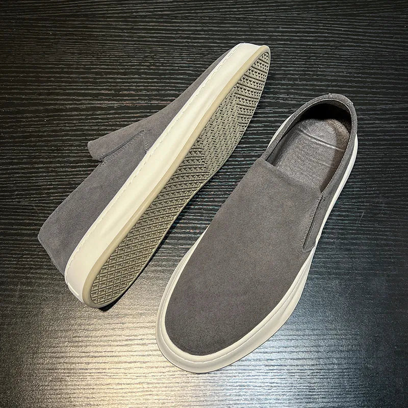Men's grey casual shoes with round toe and sewing line detail on PU upper