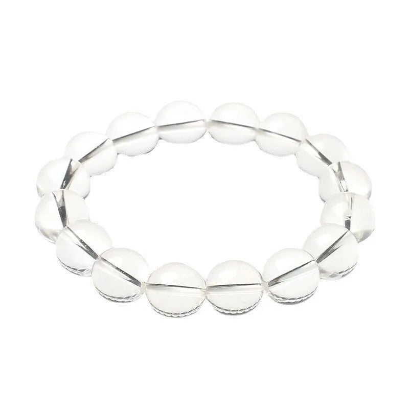 Natural Donghai old materials white water round bead crystal bracelet on a wrist, showing geometric design.