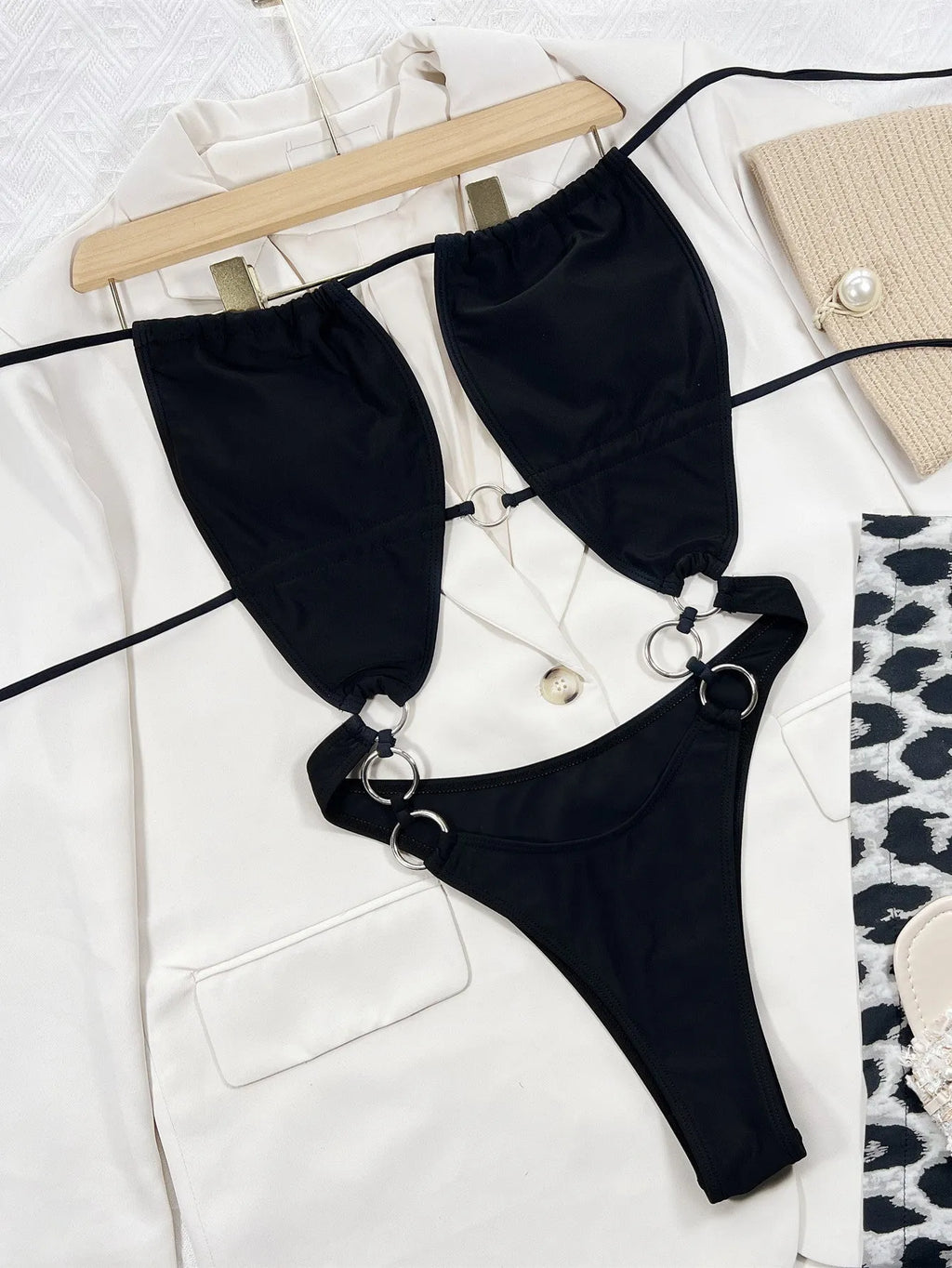 Steel Ring black solid colour one-piece swimsuit for women on a mannequin.