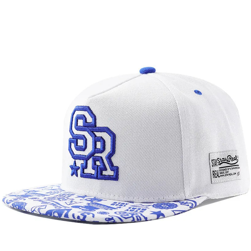 Cotton baseball cap with embroidered lettering in black or white with adjustable strap