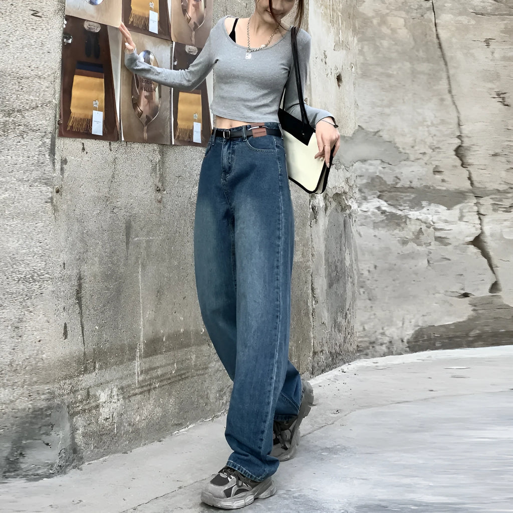 Women's retro blue high-waist straight-leg jeans on a neutral background.