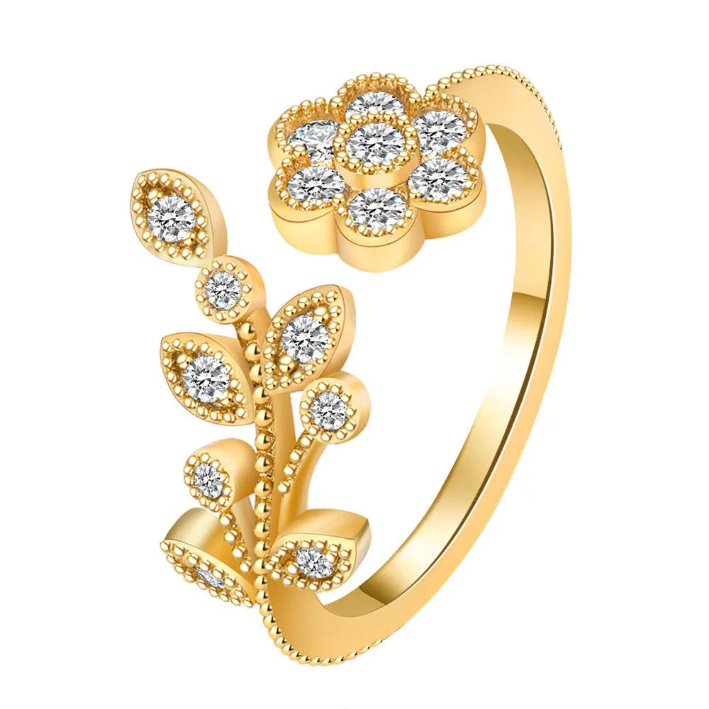Women's open ring with diamond flower and leaf design in gold or white colour on copper material