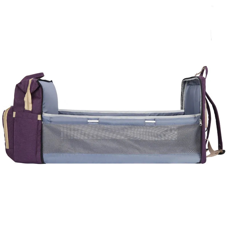 Portable lightweight nylon folding baby changing bag with USB port and shoulder strap in selected colour.
