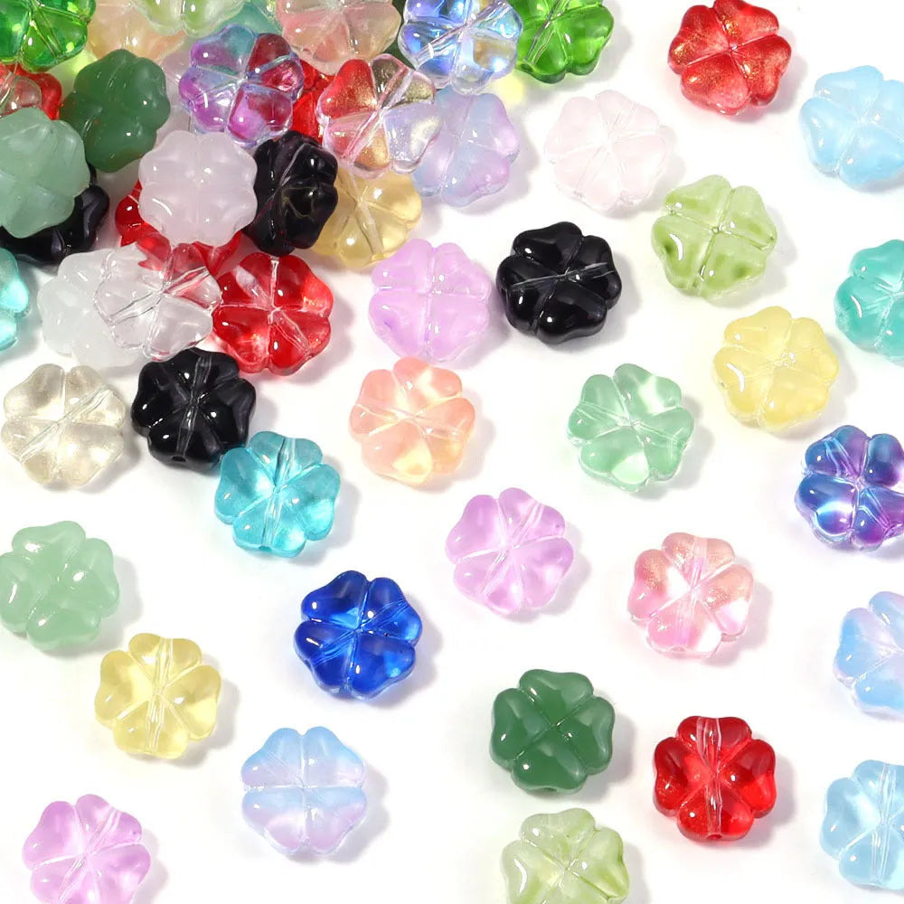 50 glass four-leaf clover beads in assorted colours with coloured glaze finish and 10mm straight hole design.