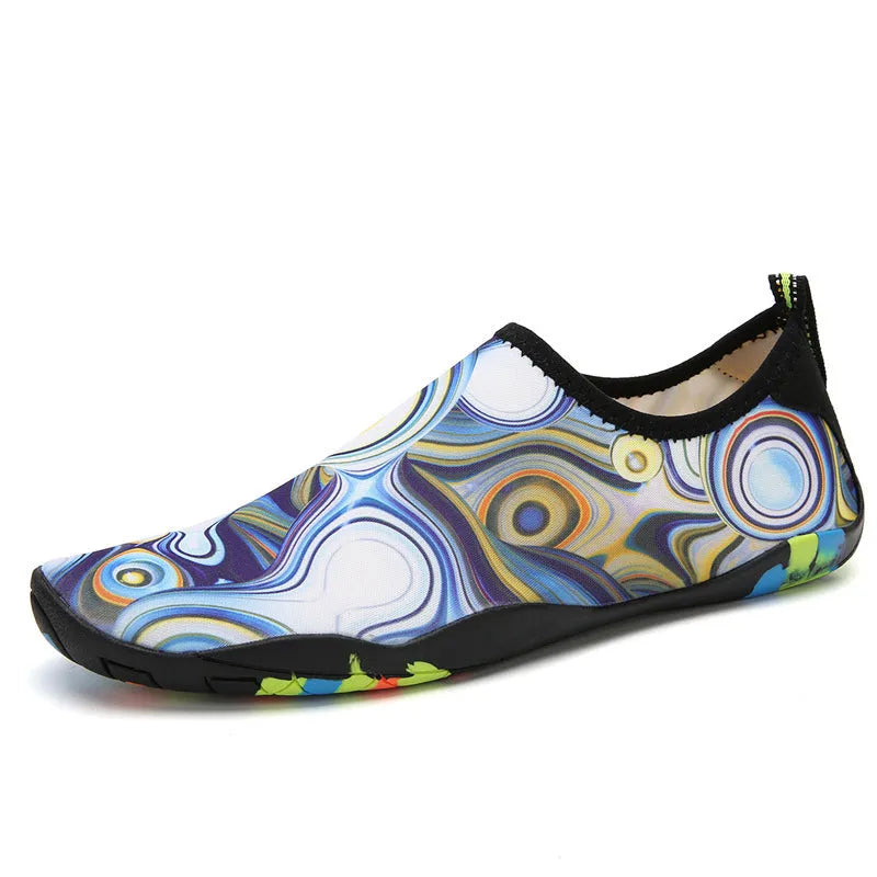 A pair of beach wading shoes for swimming, shown in camouflage colour with Lycra upper and EVA sole.