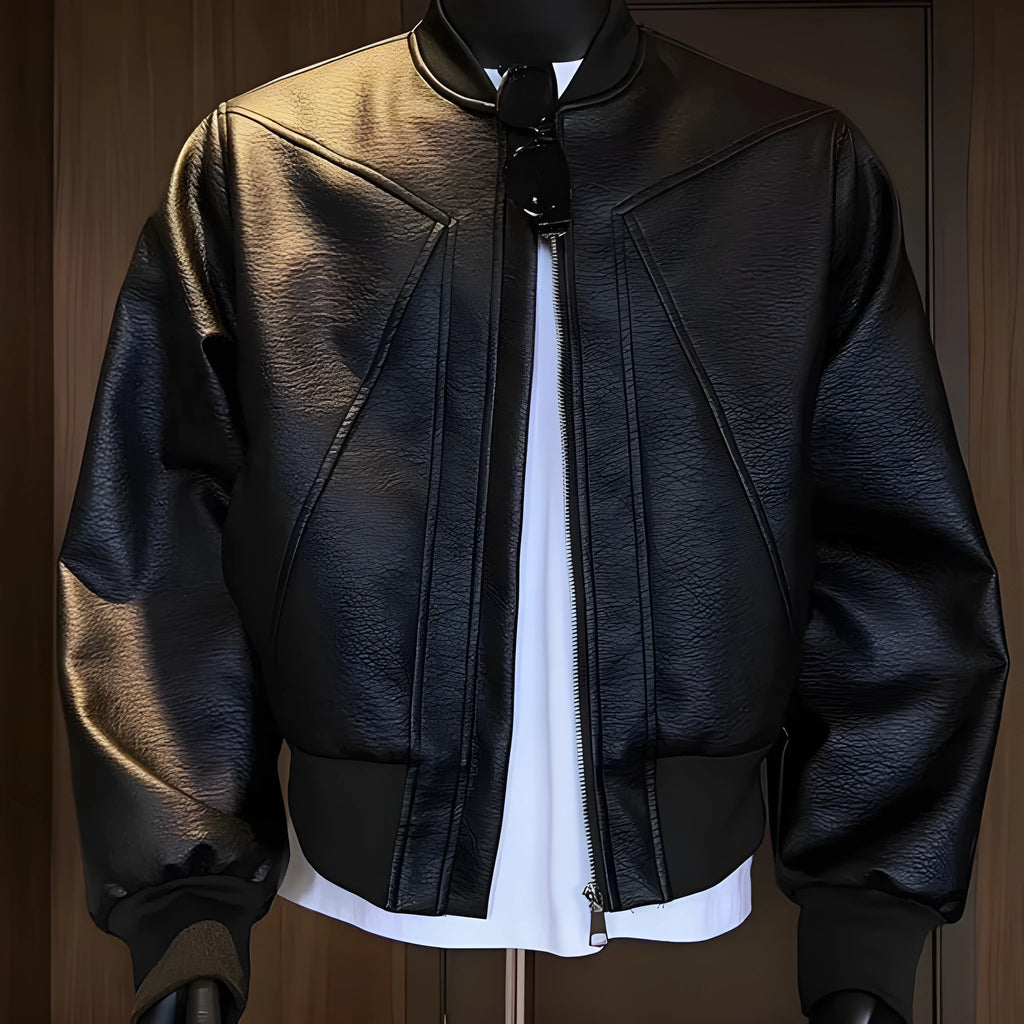 Black extended-length men's PU leather jacket with a litchi texture on a hanger.