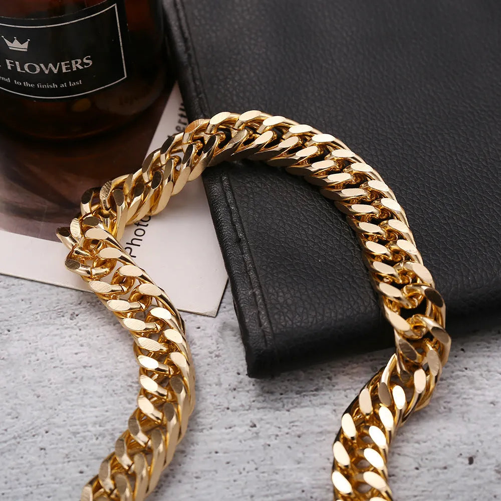 Women's gold coloured thick chain alloy necklace showing 32cm length and 6cm wide links.