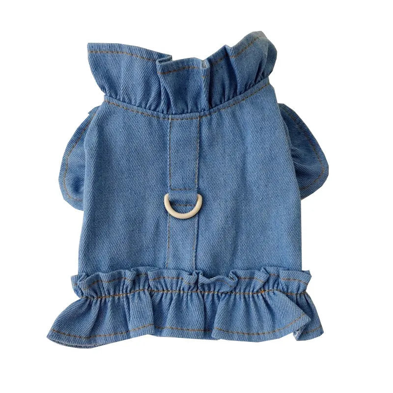 Blue denim dress for a dog or cat with ruffles and a metal leash hook on the chest.