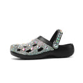 Black women's platform sandals with rhinestone details and hole design on EVA material