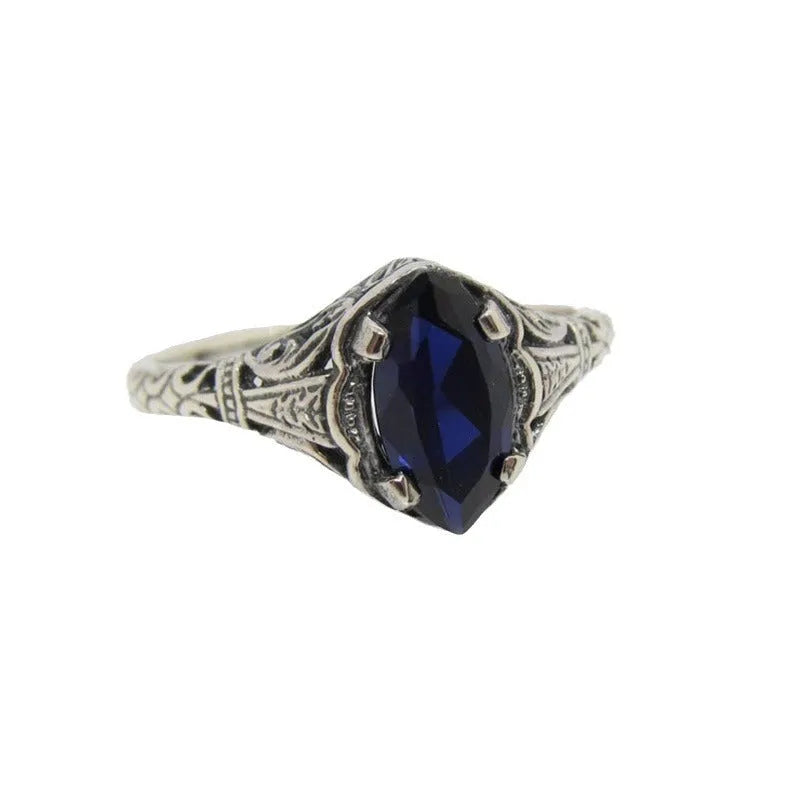 Women's geometric hollow ring in silver electroplated alloy with zircon detail showing open-work pattern