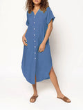 Loose-fitting casual solid colour button dress in a mid-length style on a hanger.