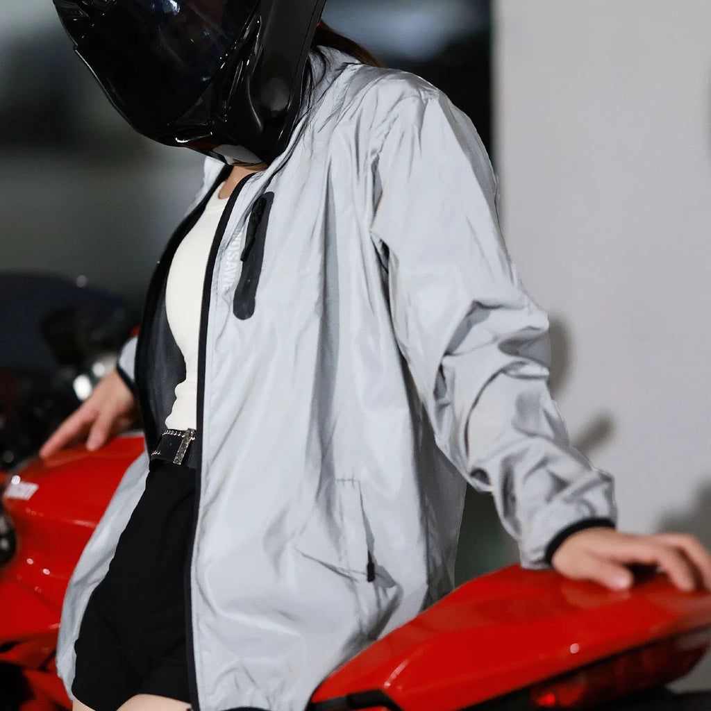 Silver waterproof polyester long sleeve windproof coat on a hanger.