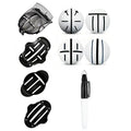 Plastic golf putter alignment scriber tool set with drawing pens on a putting green.