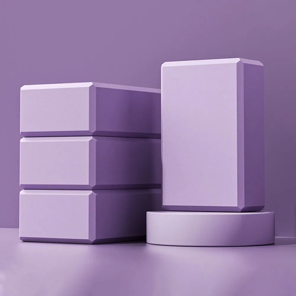 Rectangular EVA foam yoga blocks in blue pink purple rose colours showing dimensions and grip ridges