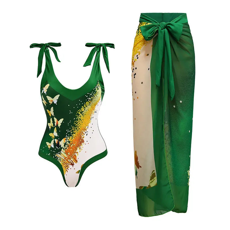 Solid colour women's one-piece swimsuit with thin spaghetti straps and a matching detachable skirt.
