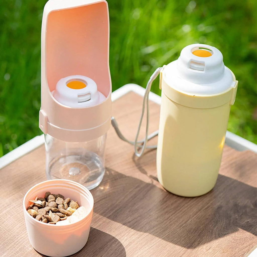 Green 2-in-1 travel dog water bottle and feeder with lanyard, folded to 20cm.