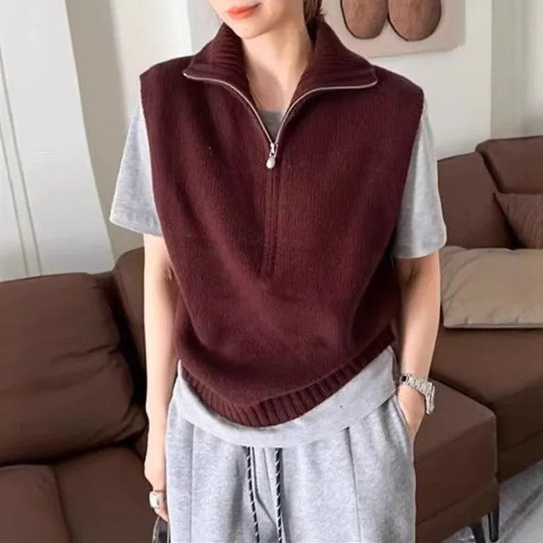 Orange retro half zip sleeveless mesh knit vest with 3D pattern showing front view