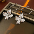 Silver needle metal flower earrings with geometric design in gold and silver electroplated finish