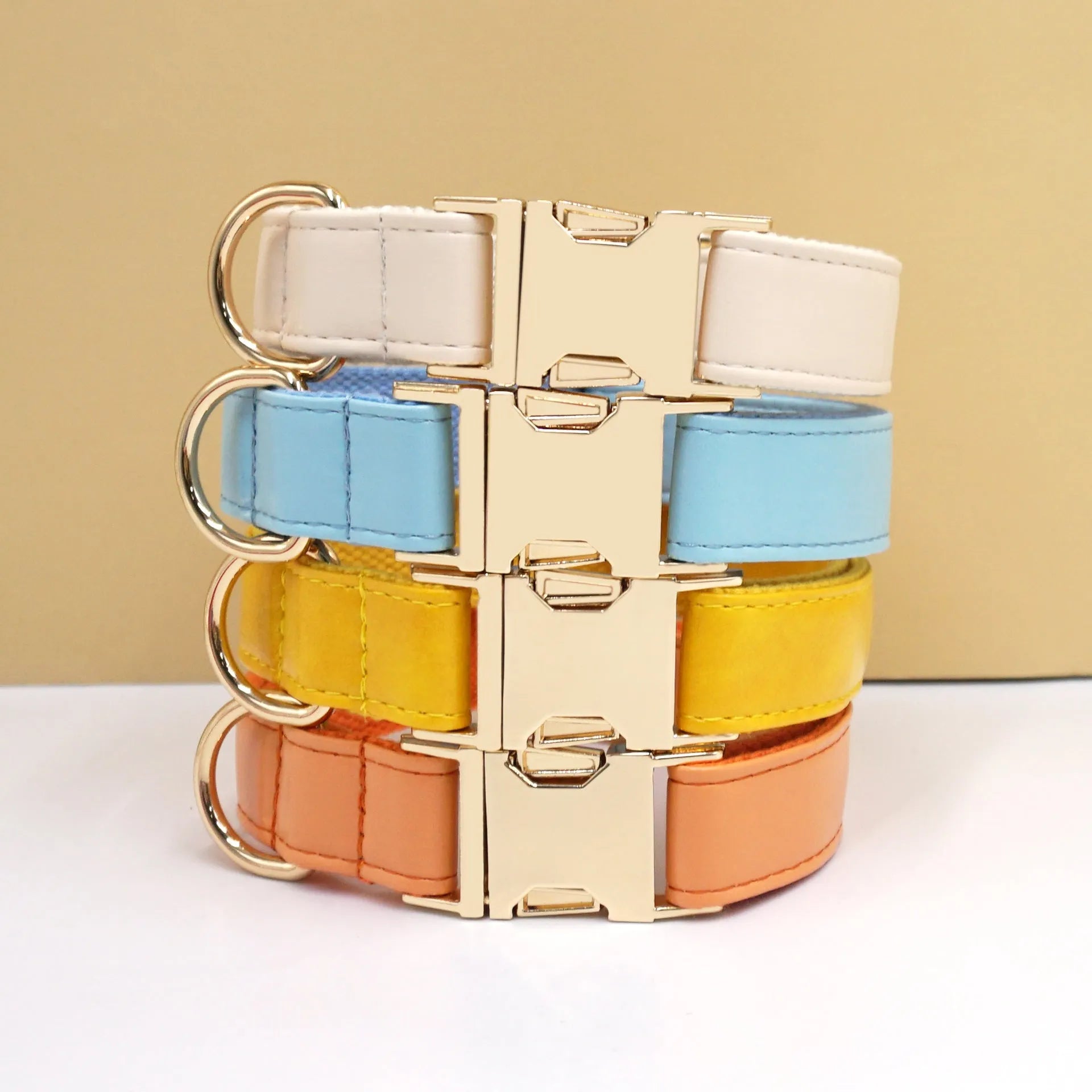 Leather Velvet-style dog collar shown in multiple colour options including caramel, dark blue, and dark brown.