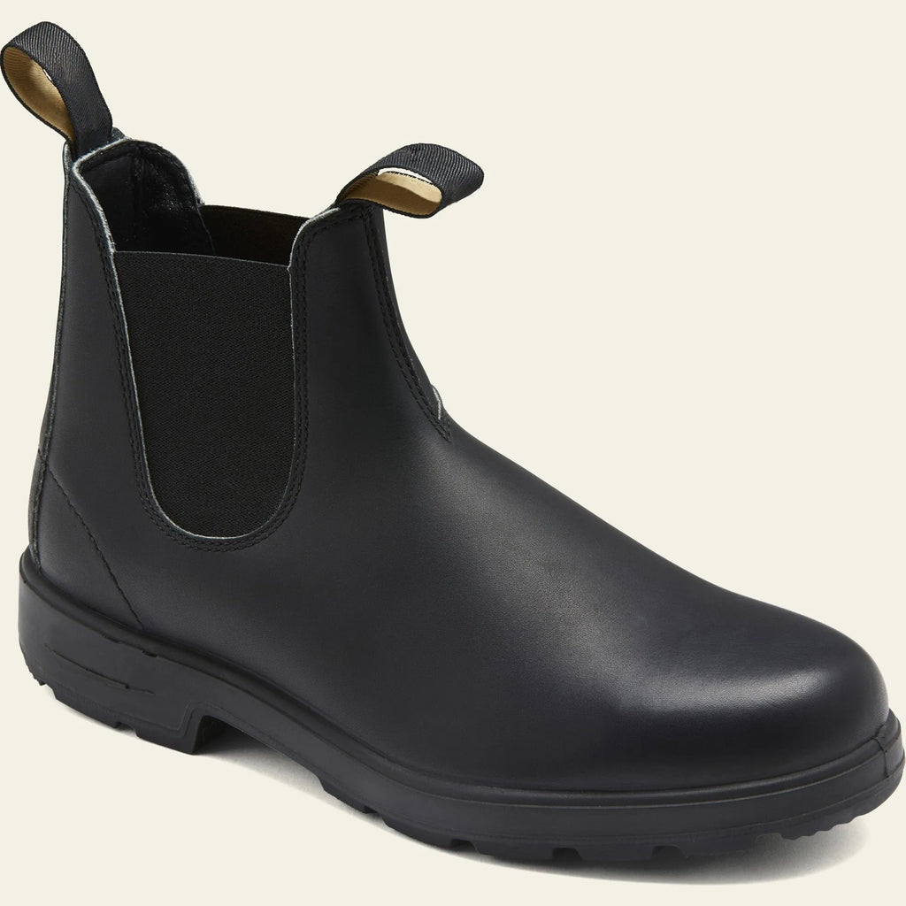 Vintage frosted brown PU leather Chelsea boots for men and women on a wooden surface.