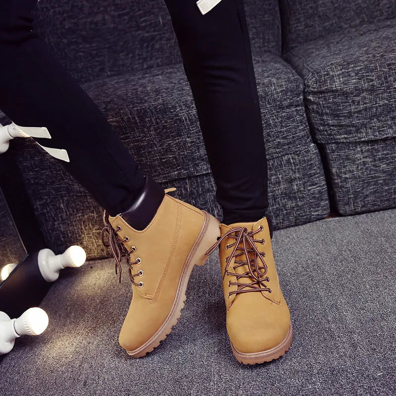 Men's pink high-top Martin boots with velvet lining, round toe, and front lace-up closure on a flat sole.