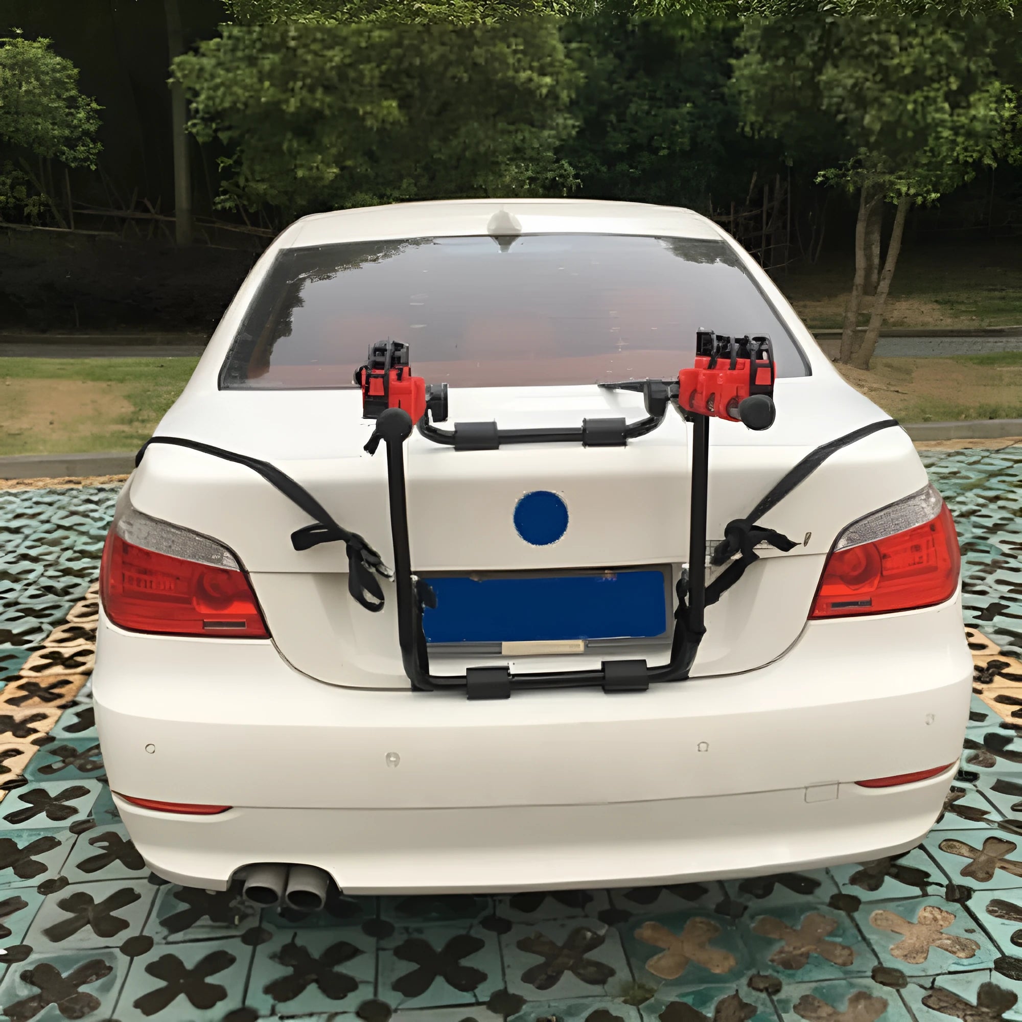 Black and red trunk mounted bike rack for cars with tie rope and pull belt fastening options.