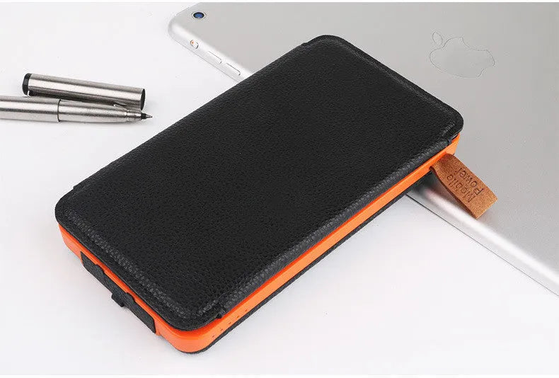 Outdoor rainproof solar phone charger with LED light in multiple colour options on a rustic surface.