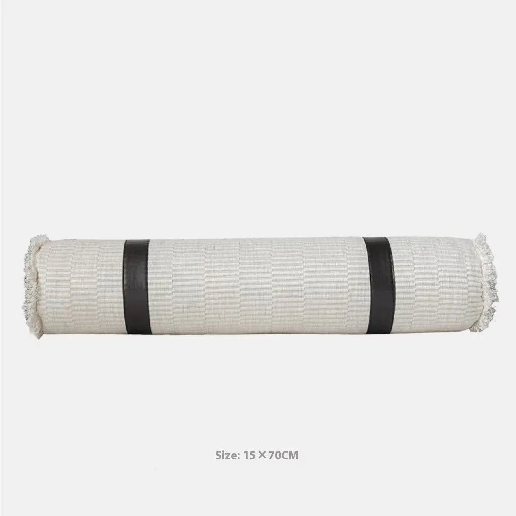 Grey and white plaid bed runner blanket and matching pillow on a double bed.