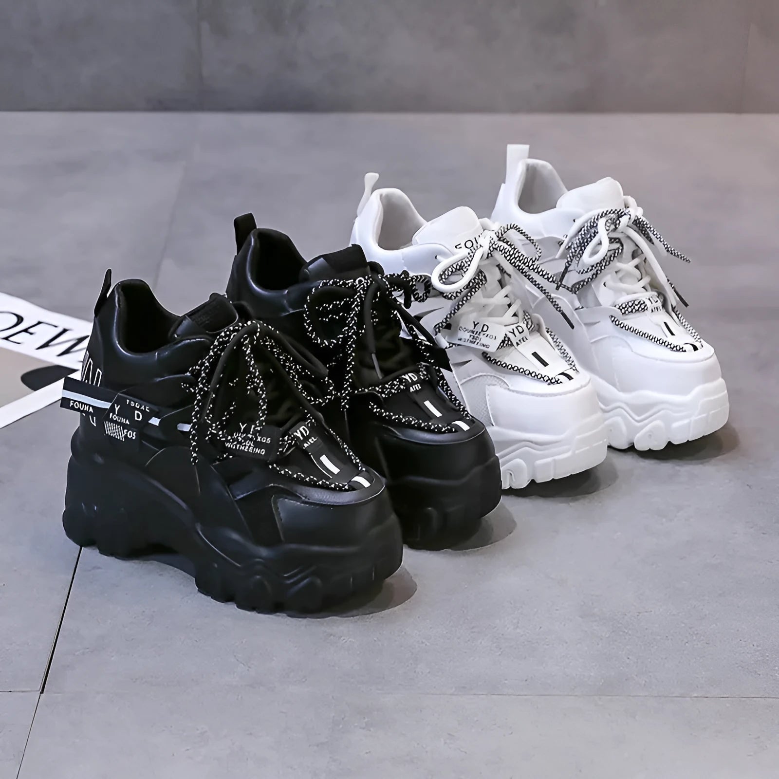 Women's white mesh platform sports shoes with cross strap and a high rubber sole.