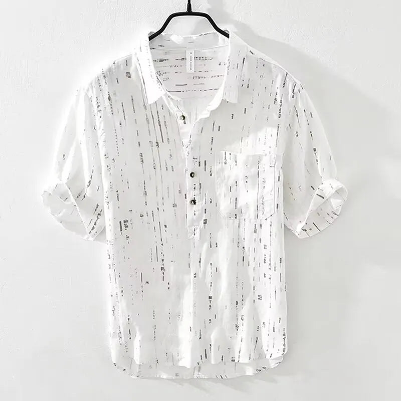 Men's loose fit black and white short sleeve polo shirt on a hanger