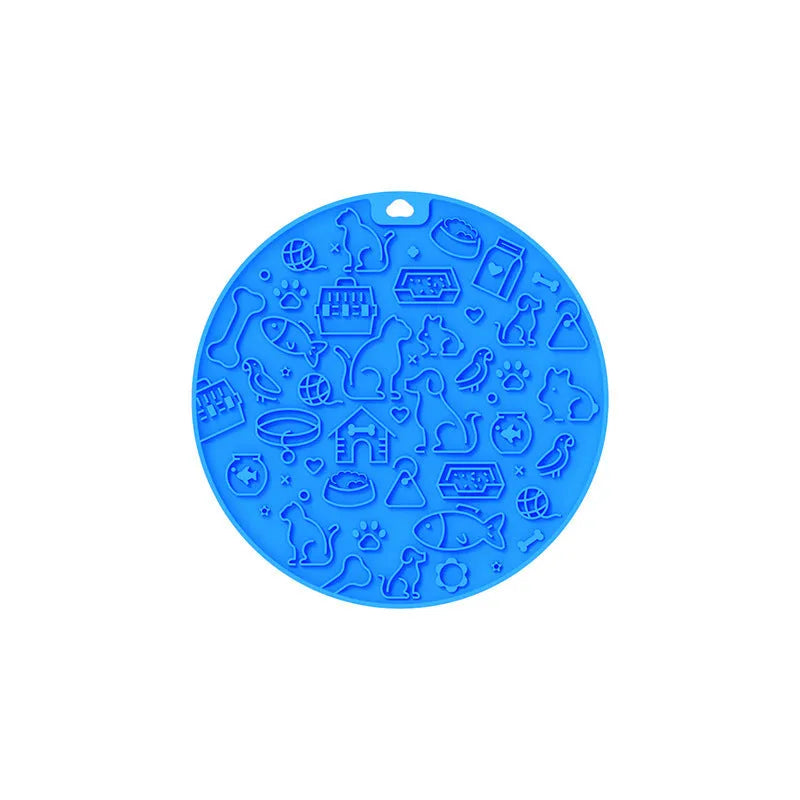 Round grey silicone pet lick mat with textured surface and a clear suction cup on its base.
