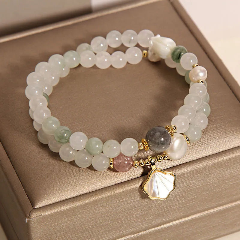 Tianshan emerald green crystal bracelet with gold-plated ginkgo leaf pendant and rhinestone details
