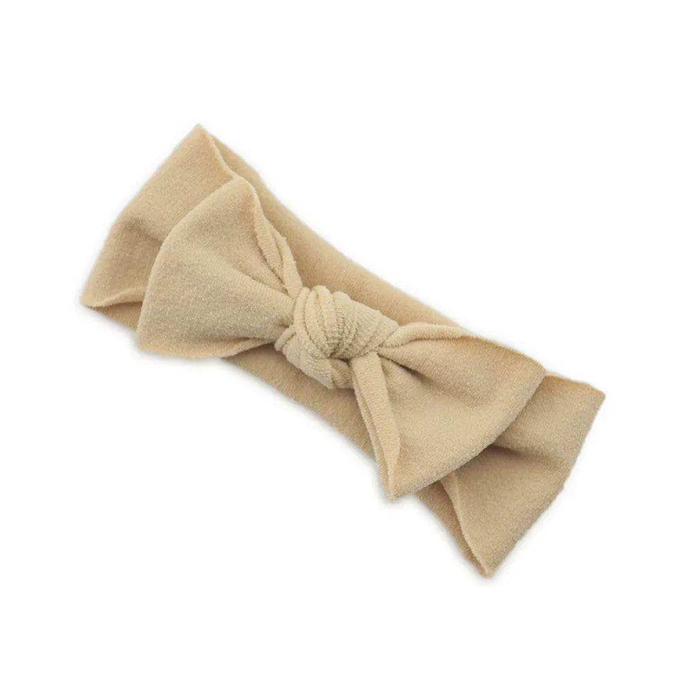 Solid colour knotted cloth headband for baby girls with bowknot design, available in 37 colours
