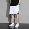 Boys cotton shorts in black, khaki, or white, shown in a loose-fitting Japanese style for summer.