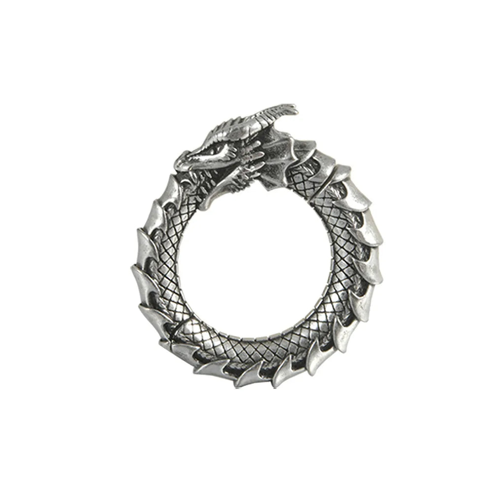 A pair of antique silver alloy earrings in a geometric dragon shape with hollow out design.