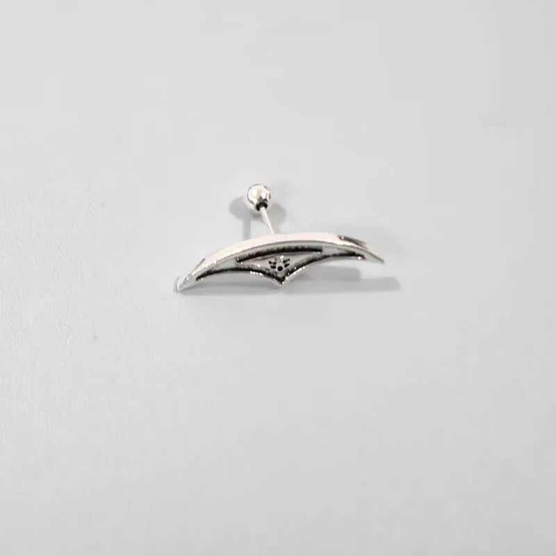 Geometric spider web stud earrings with electroplated gold and silver metallic finishes