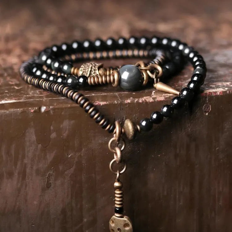 Black multi-layered beaded bracelet with geometric shape and natural retro styling