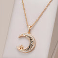 Rose gold star and moon necklace with enamel detailing on adjustable water wave chain