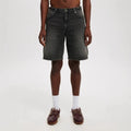 Men's loose fit light blue denim jeans with straight leg on a neutral background