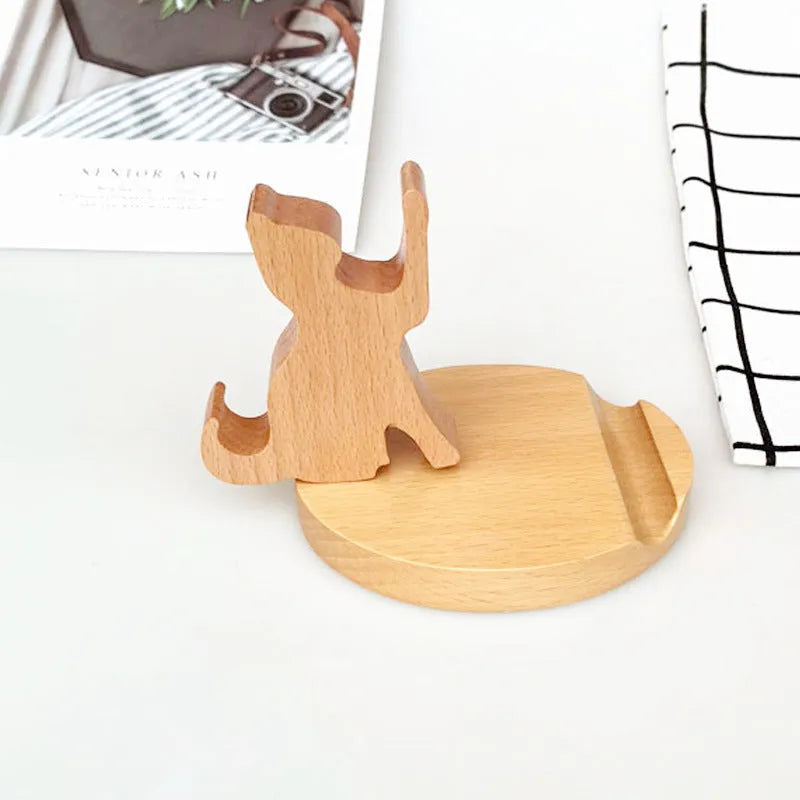 Decorative resin mobile phone stand in a choice of styles including animal figures and wood-effect designs.