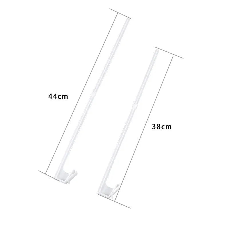 Ten white plastic car window flag pole holder clips laid out.