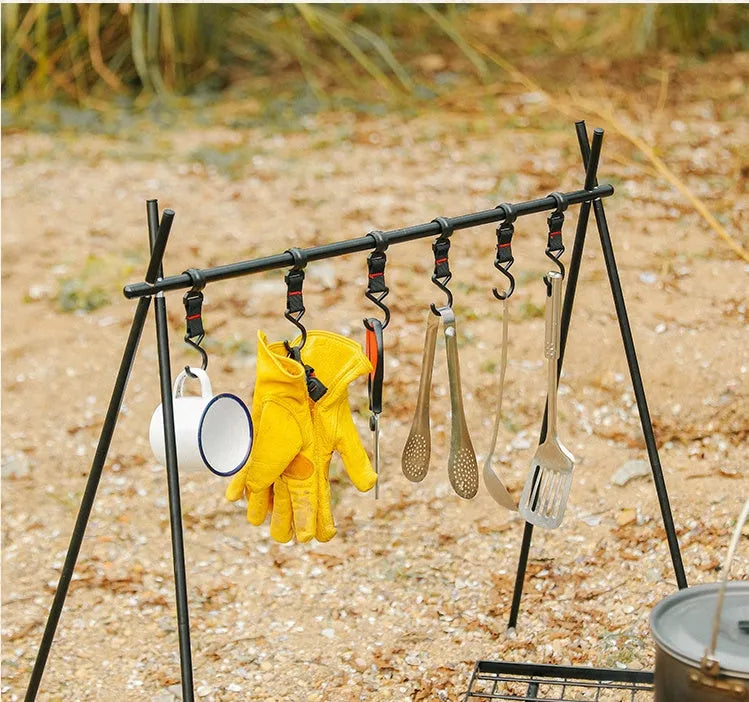 Aluminium foldable triangle camping clothes drying rack with 5 hooks displayed outdoors